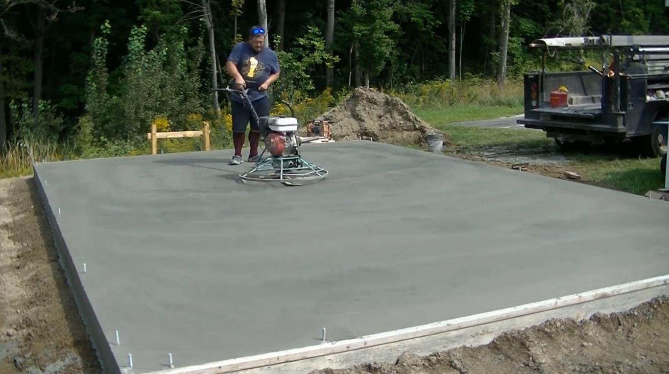 Concrete contractor using professional equipment to finish concrete slab in Norwalk, CA
